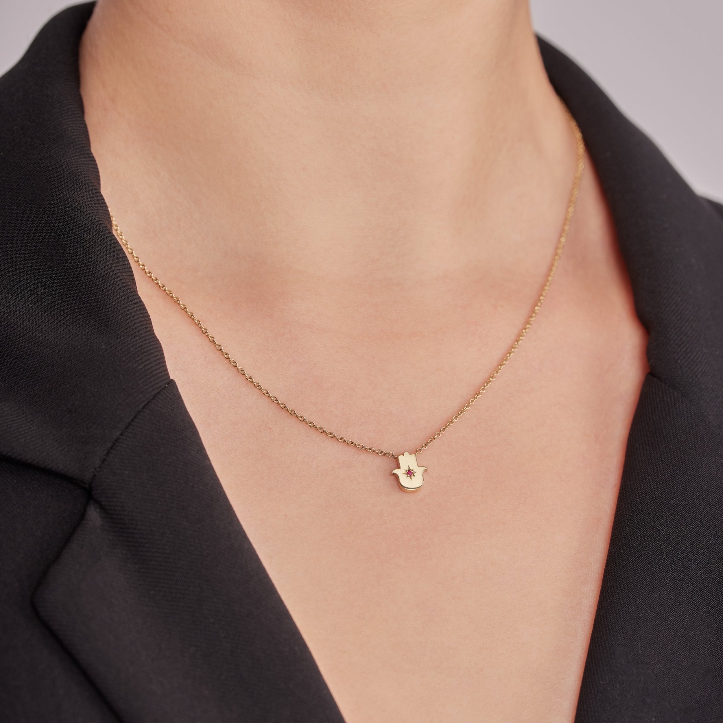 Floating Hamsa gold necklace with gem stone Ruby