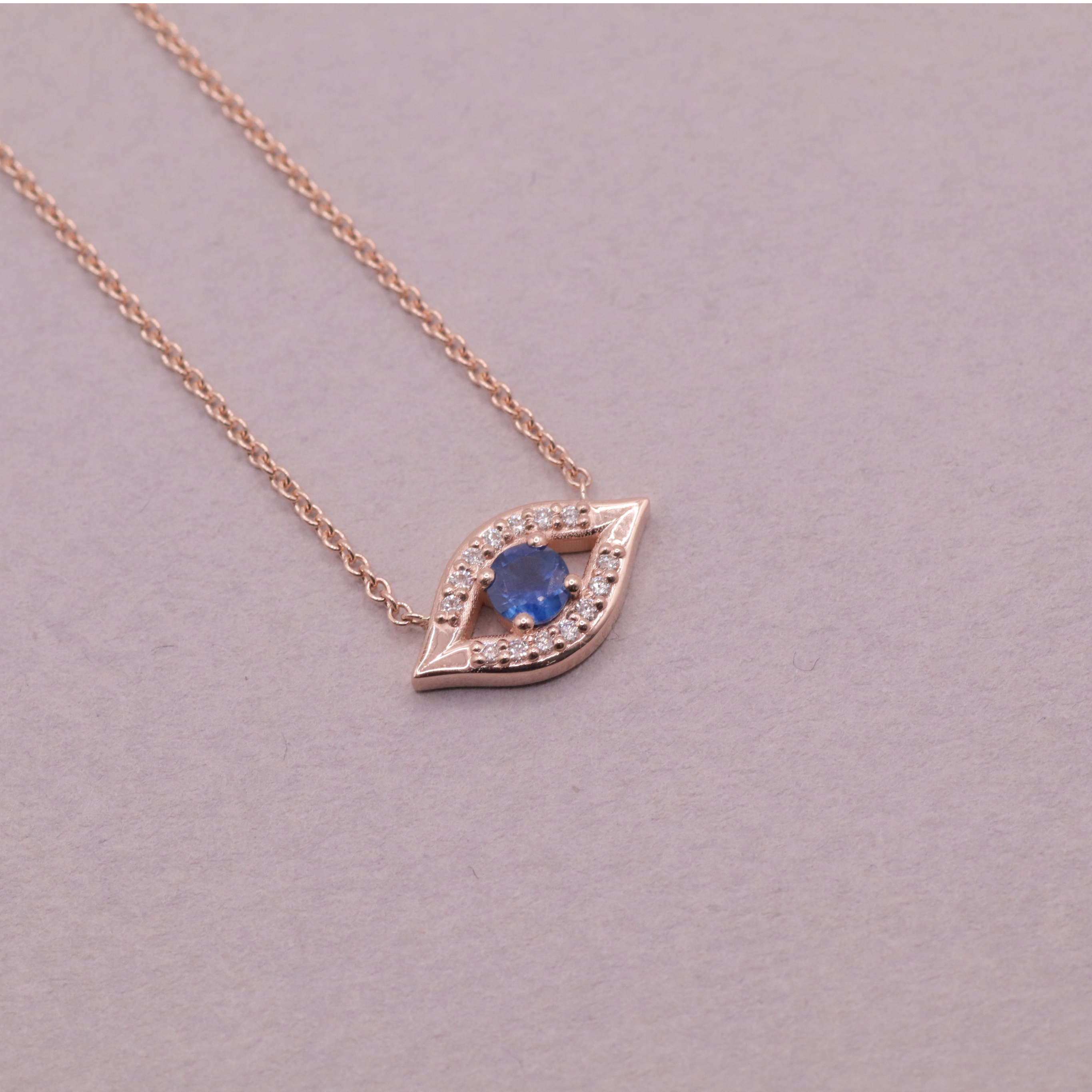 Evil Eye floating Gold Necklace Sapphire and Diamonds