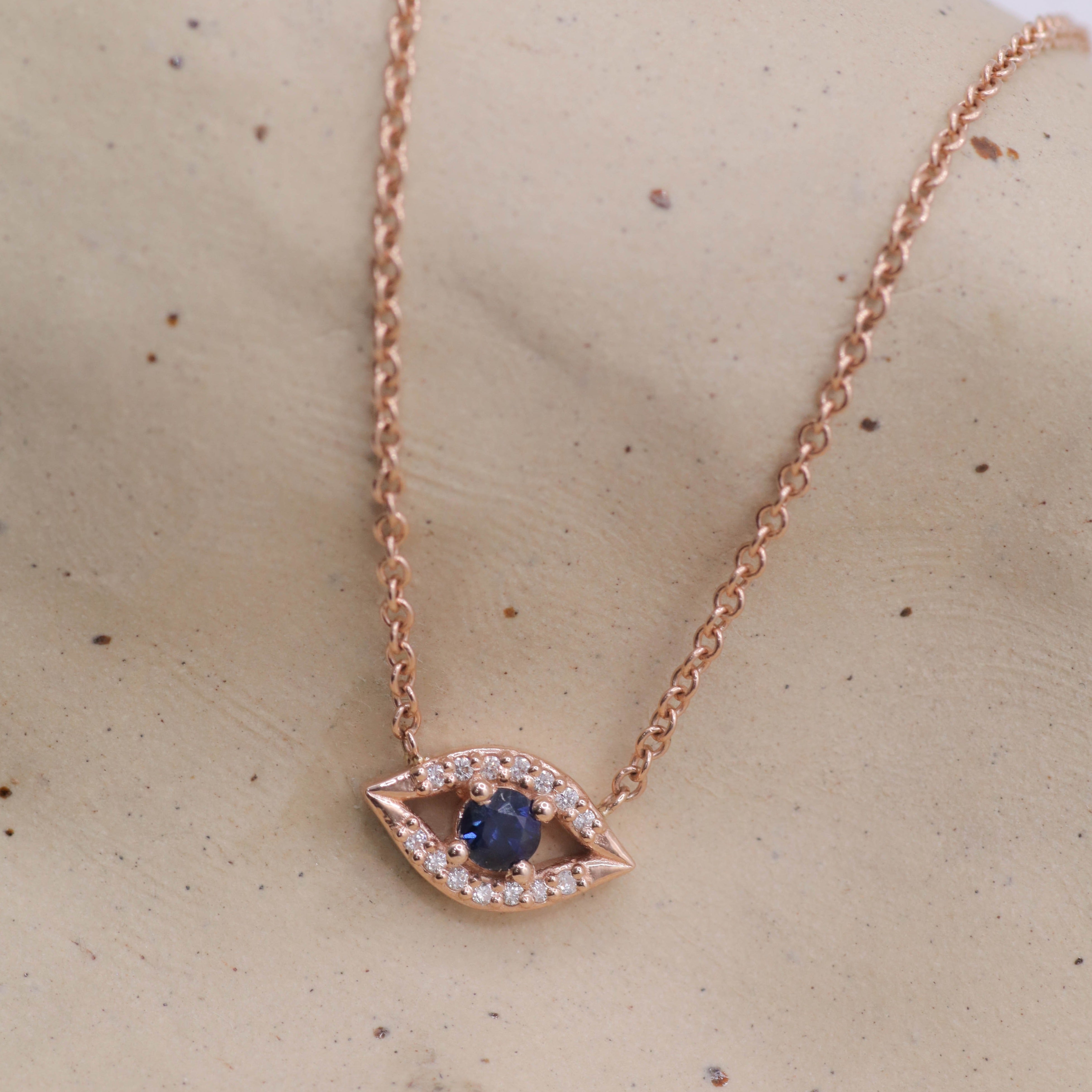 Evil Eye floating Gold Necklace Sapphire and Diamonds