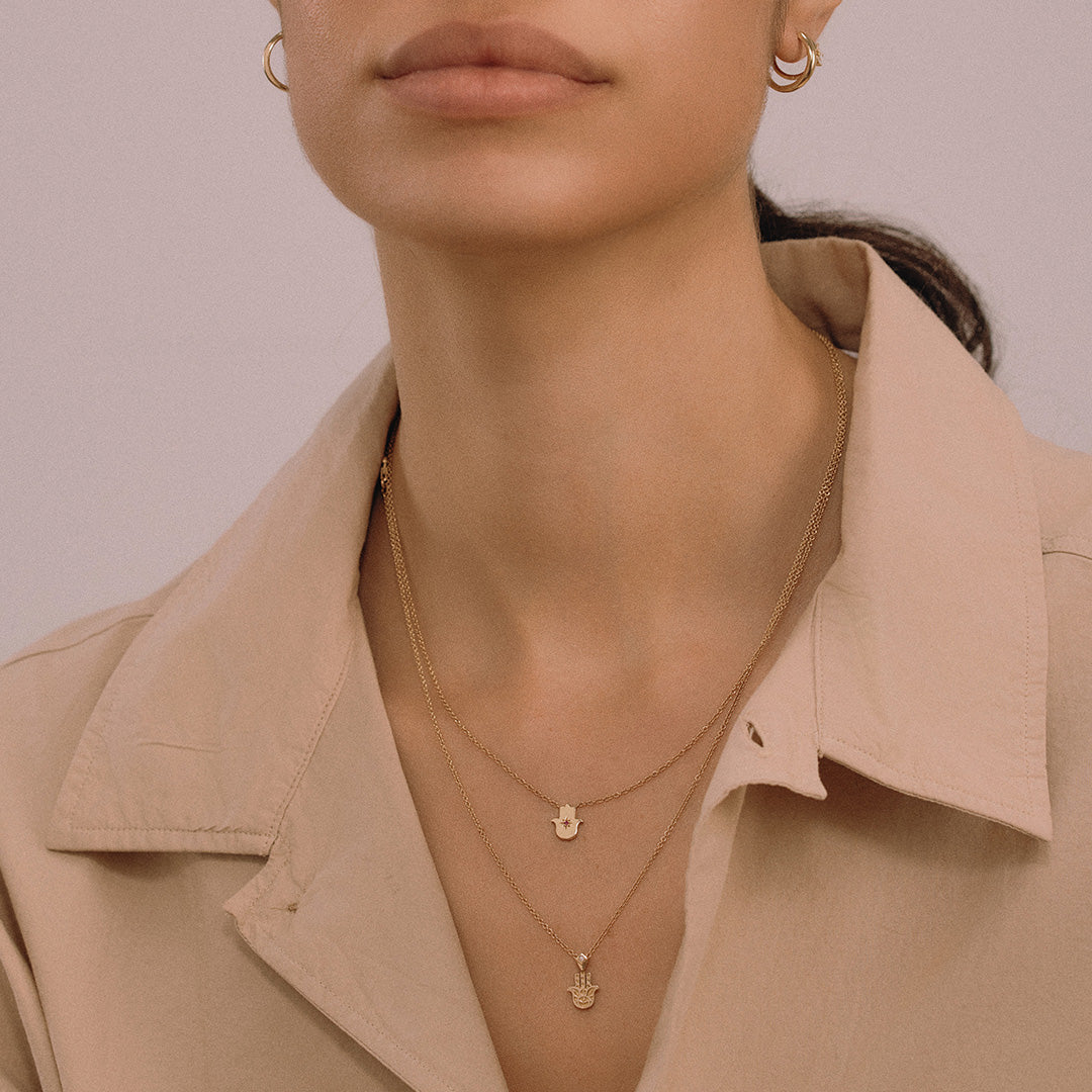 Floating Hamsa gold necklace with gem stone Ruby