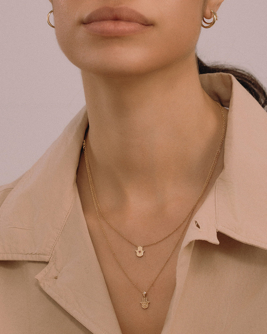 Floating Hamsa gold necklace with gem stone Ruby