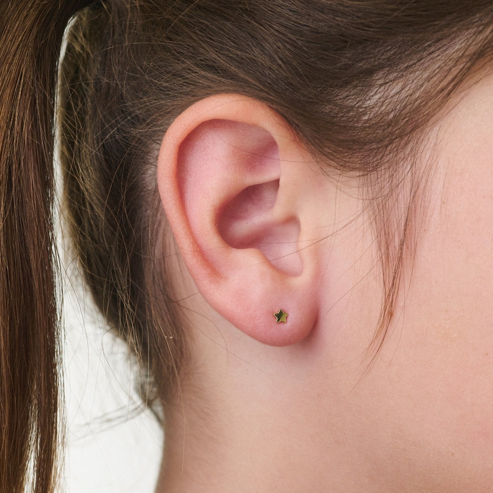 Gold star earring