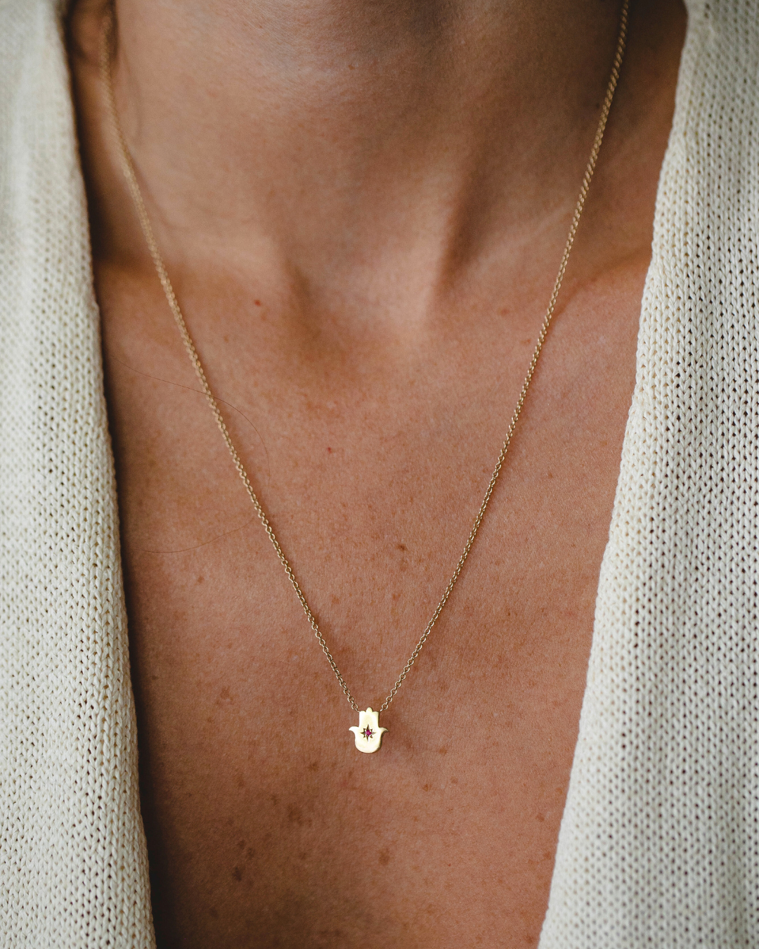 Floating Hamsa gold necklace with gem stone Ruby