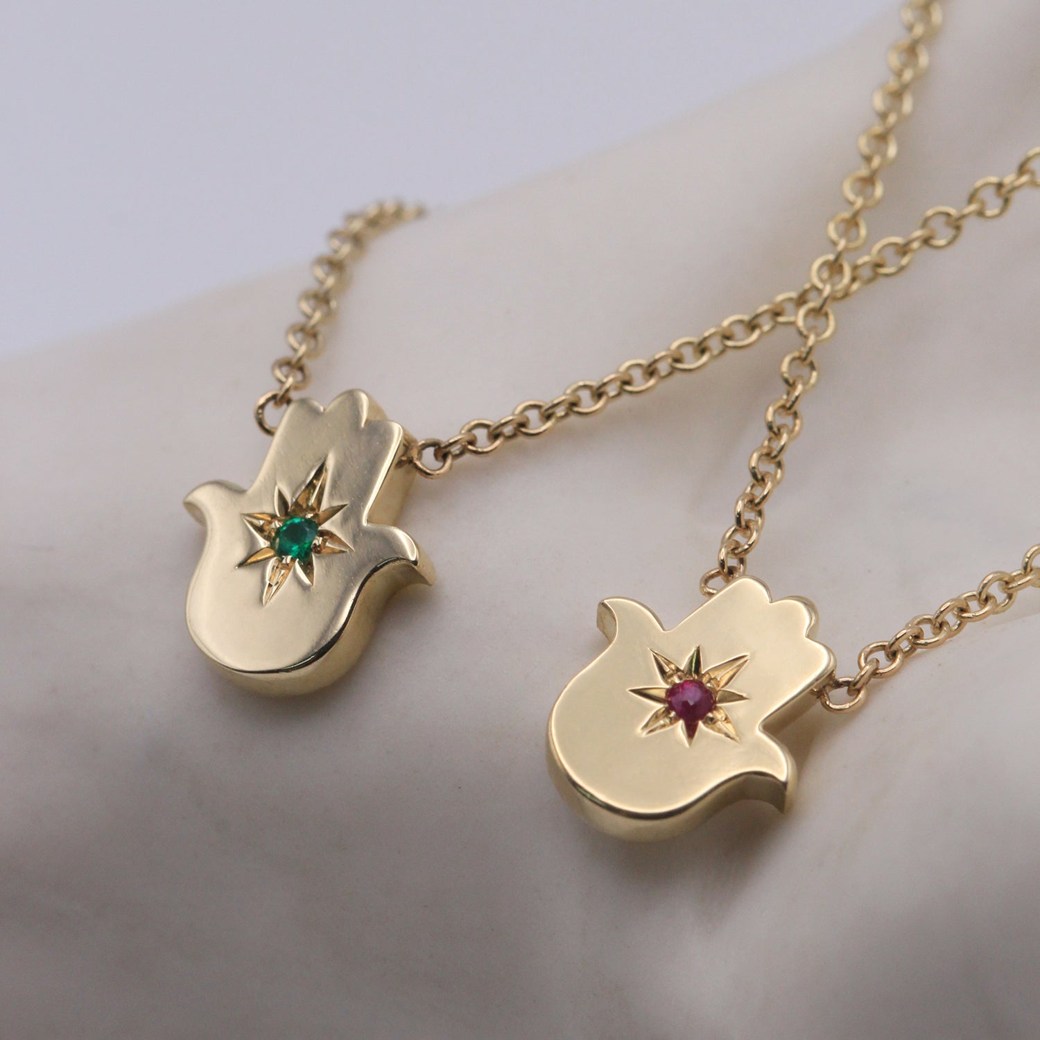 Floating Hamsa gold necklace with gem stone Emerald