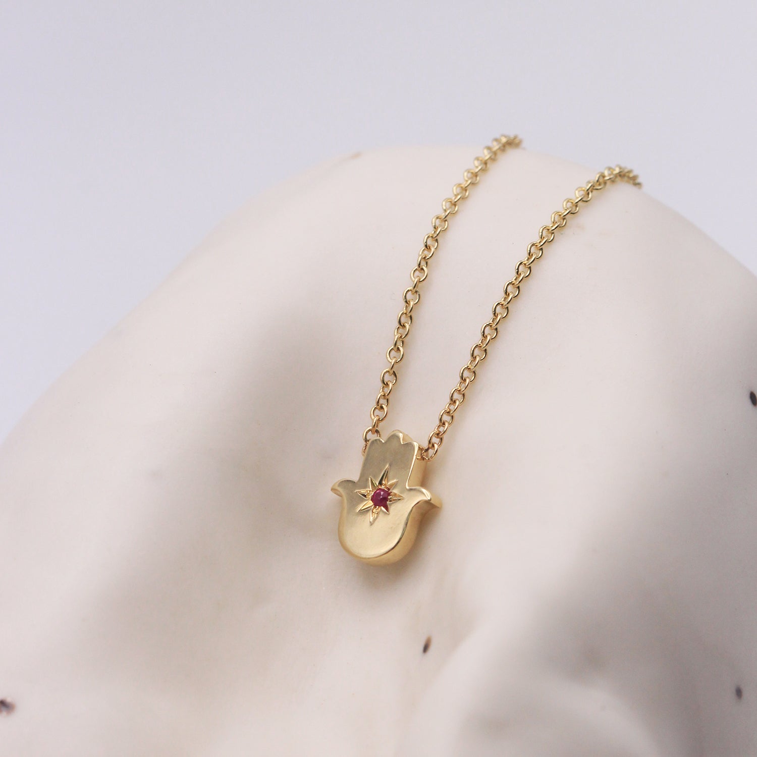 Floating Hamsa gold necklace with gem stone Ruby