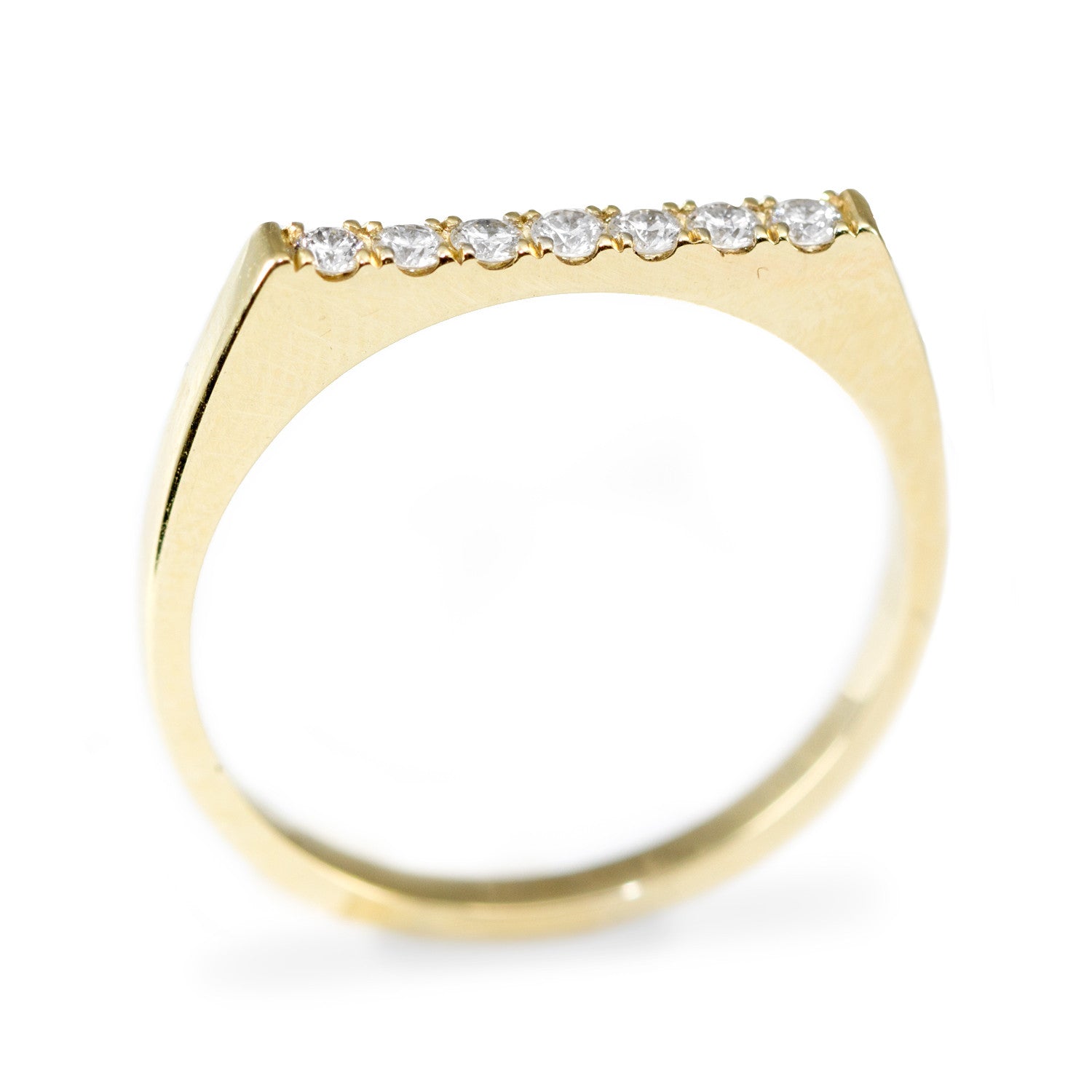 row of diamonds on gold ring