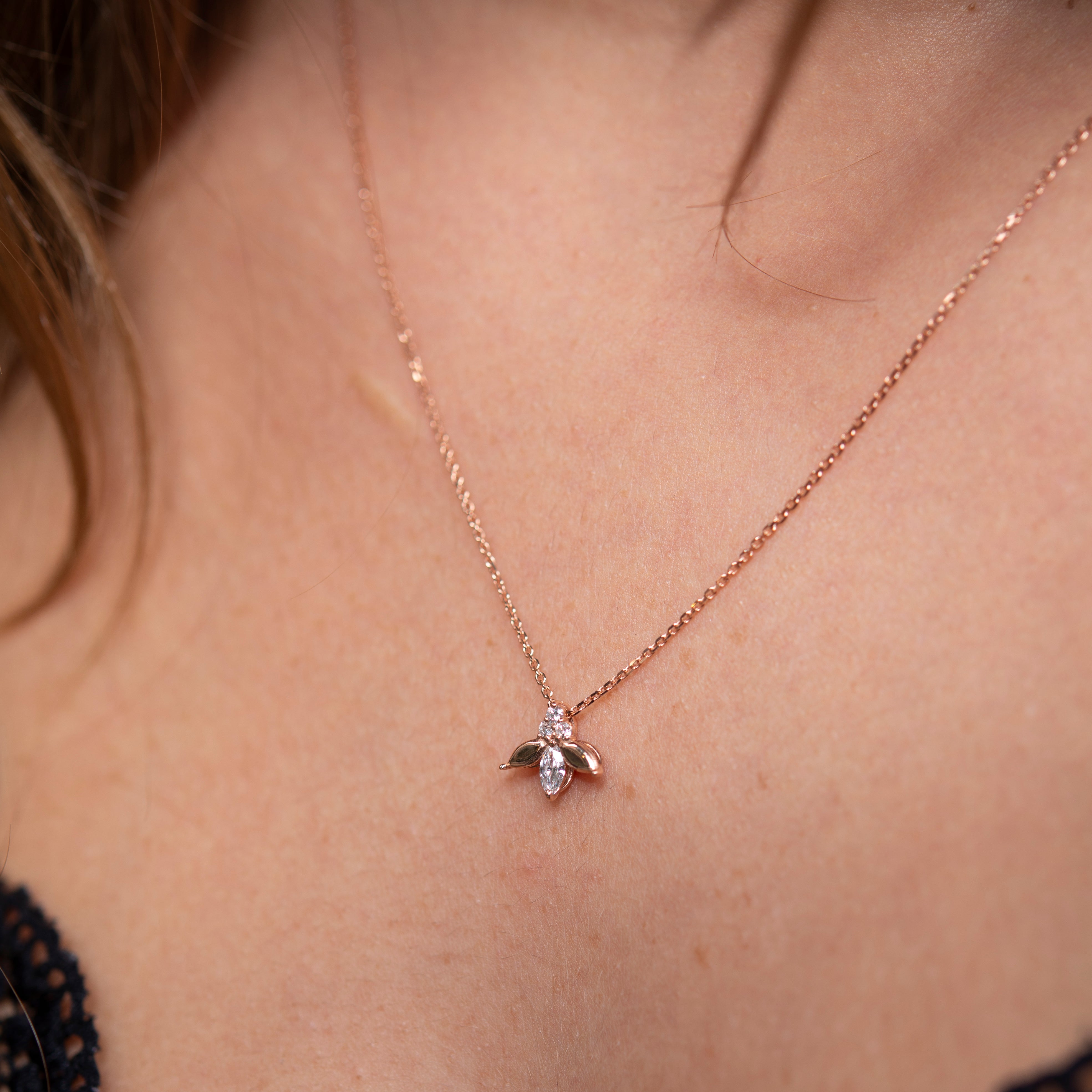 lady bug looking gold necklace with diamonds