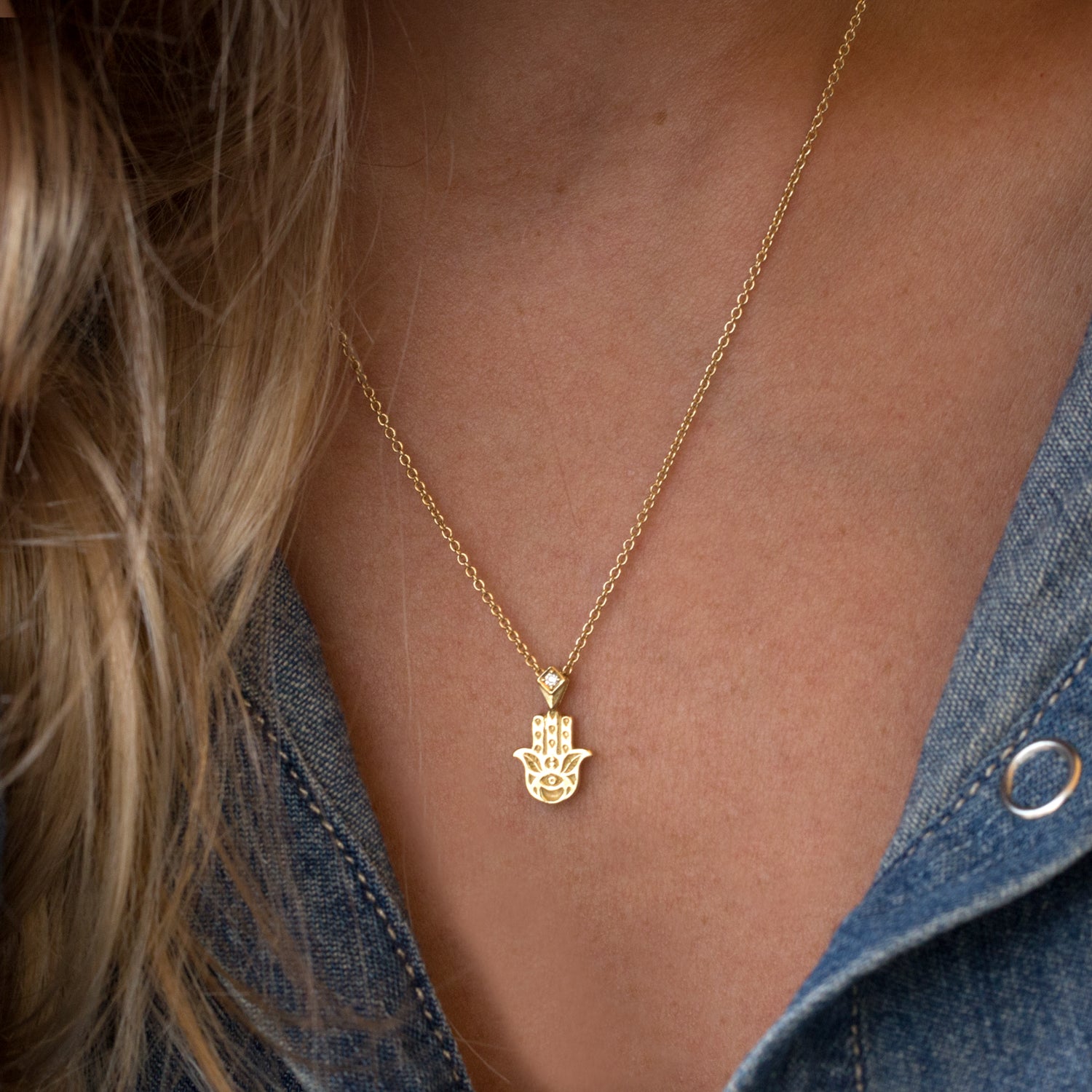 hamsa necklace with delicate decorations