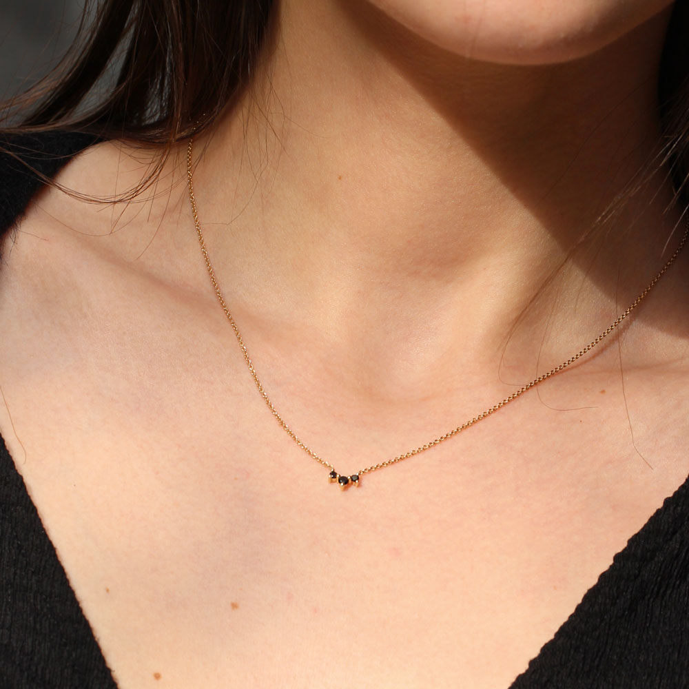 3 black diamond necklace on a model