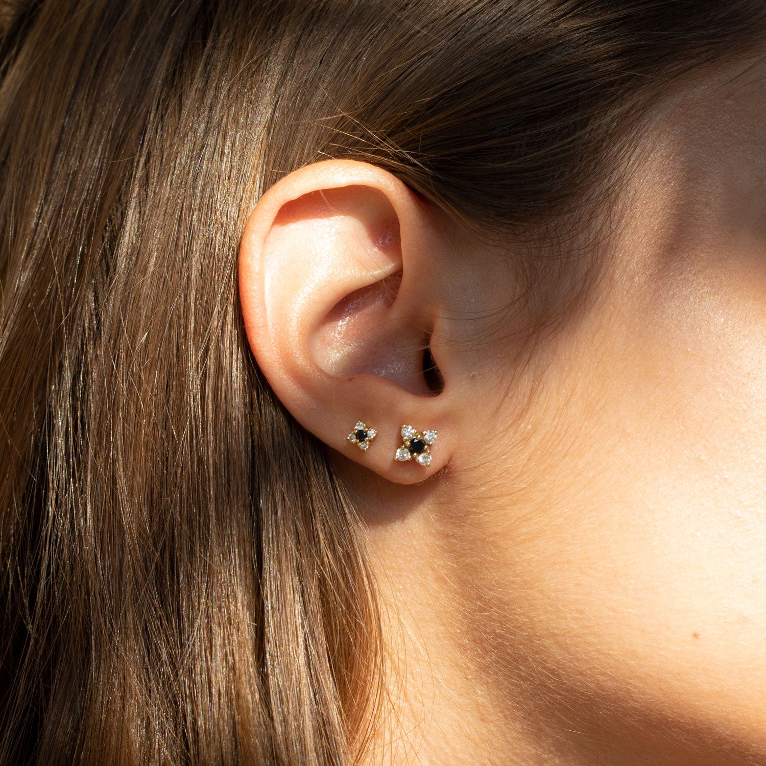 gold flower earrings black and white diamonds