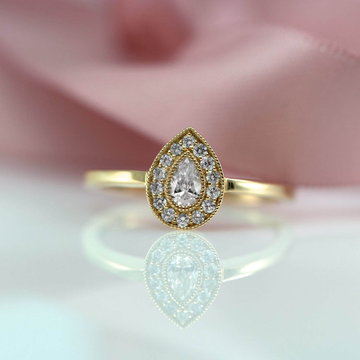 pear shaped diamond halo ring