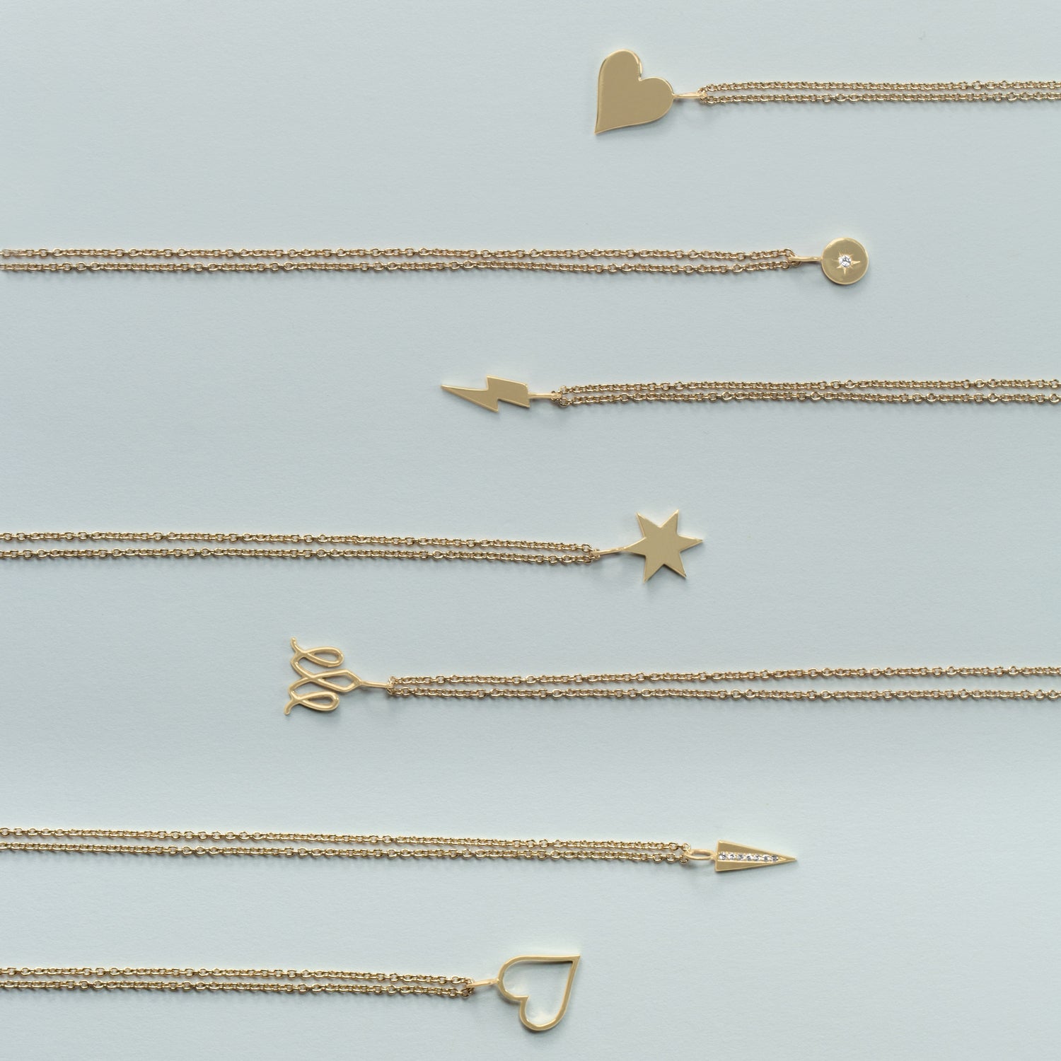 Triangle necklace set with row of diamonds