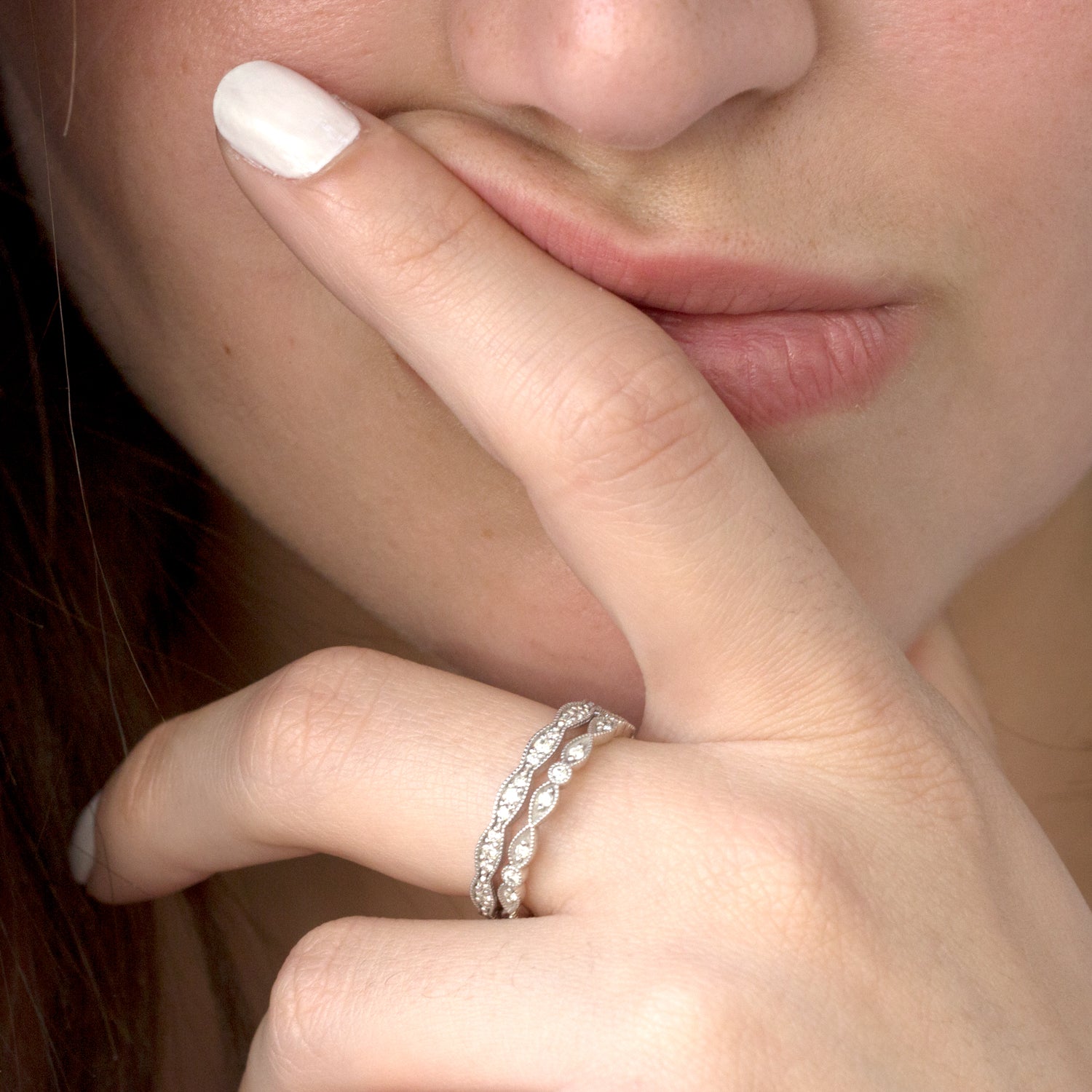 white gold wavy ring with diamonds