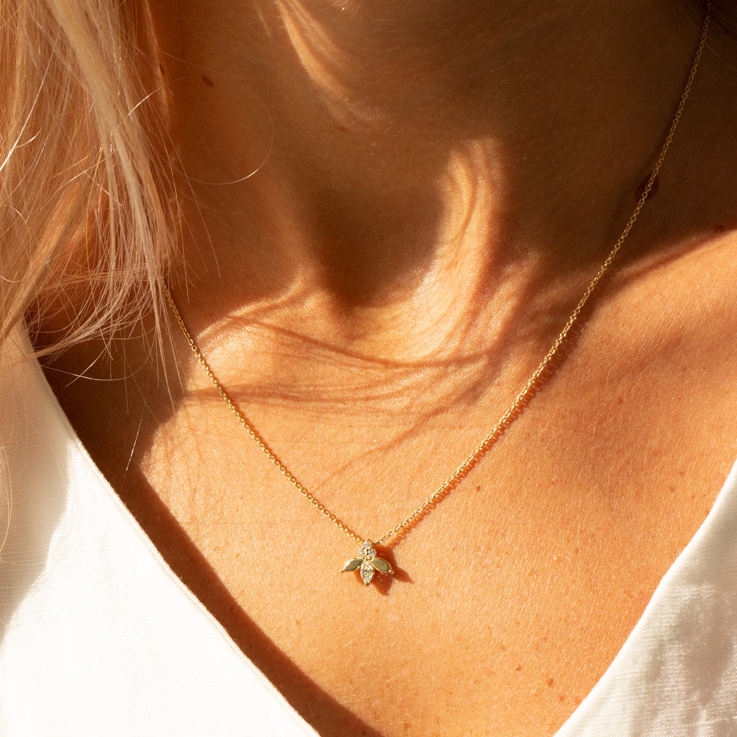 white marquise and round diamond gold necklace