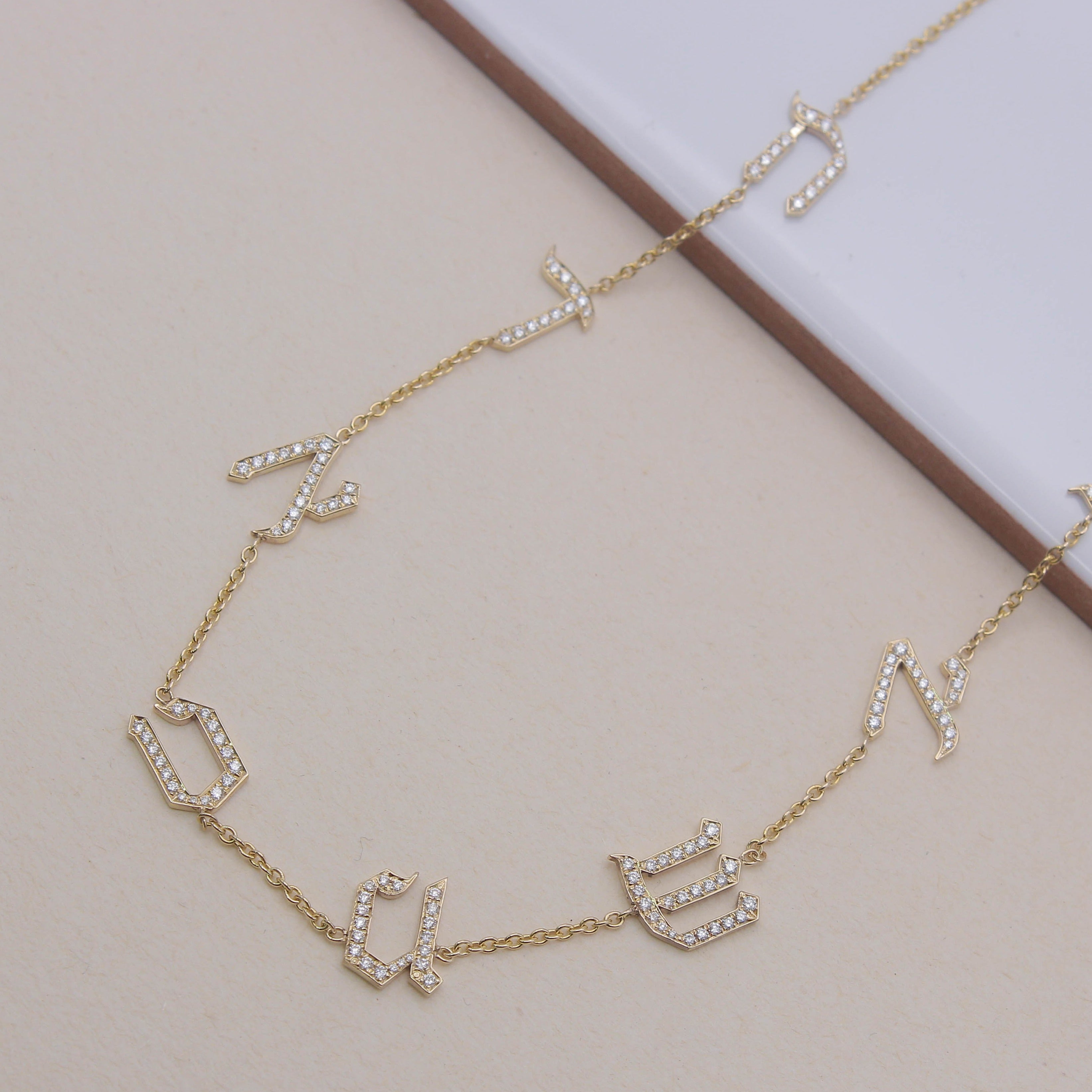 Eight letters necklace set with diamonds