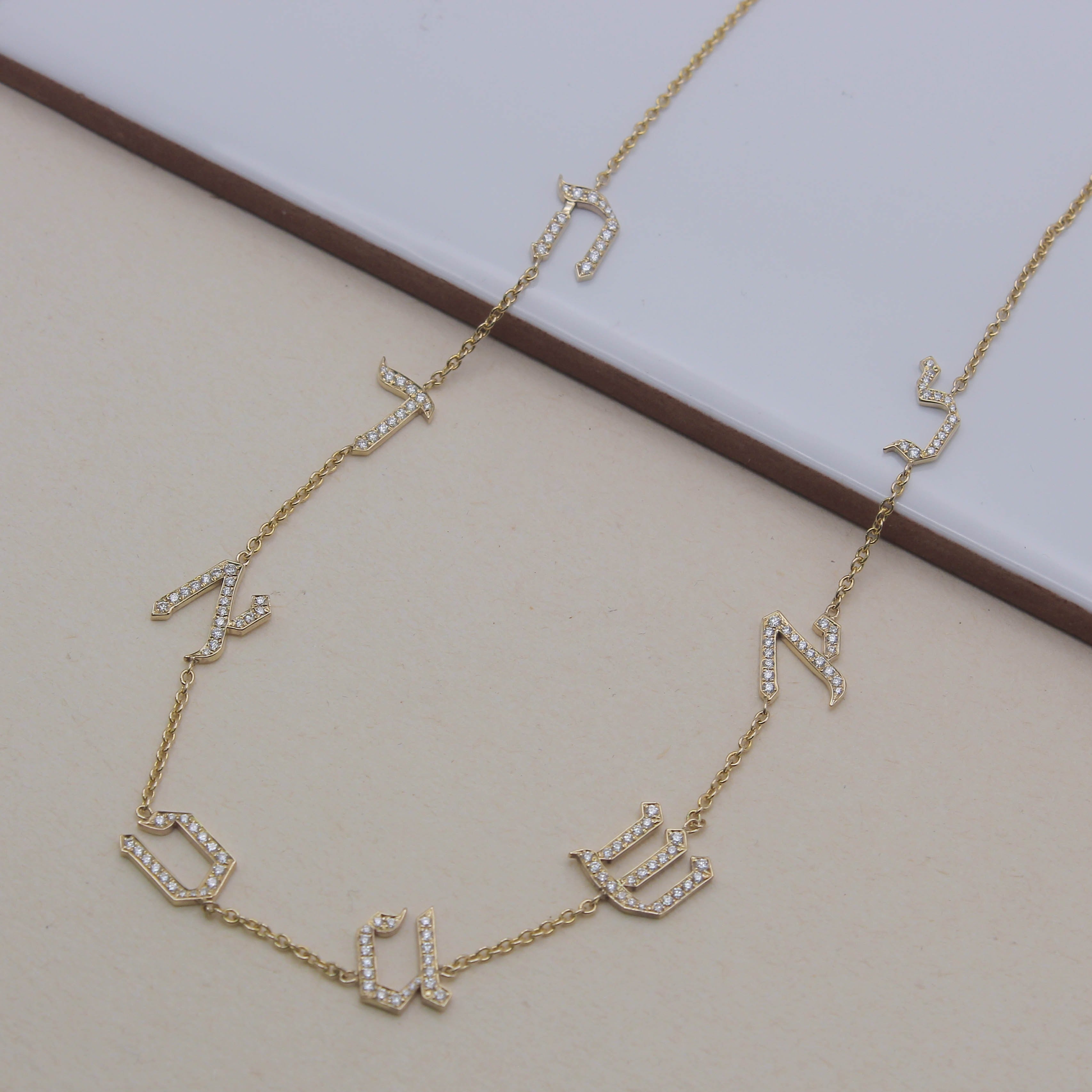 Eight letters necklace set with diamonds