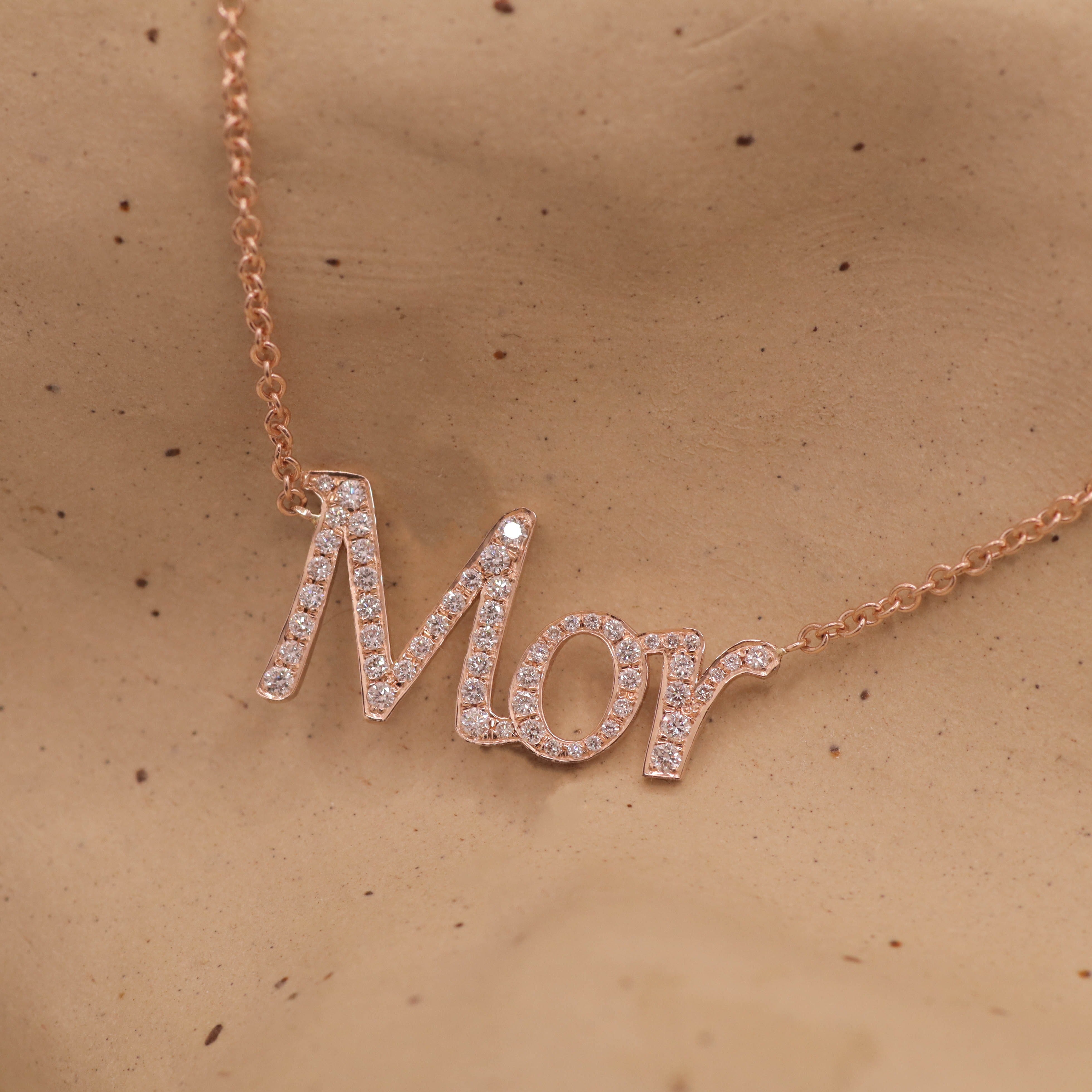 Name necklace set with diamonds
