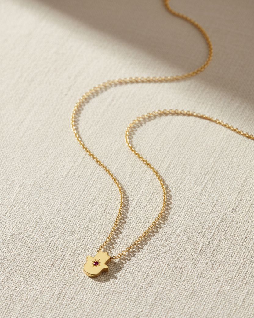 Floating Hamsa gold necklace with gem stone Ruby