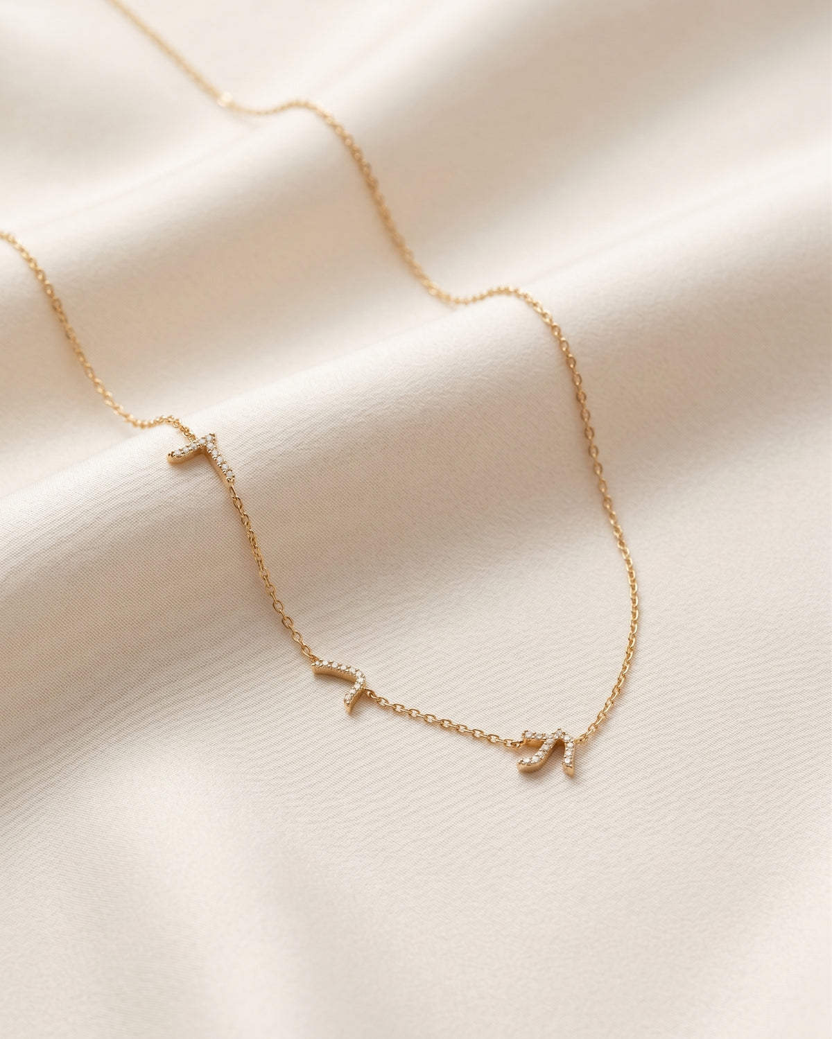 Three letters Necklace set with diamonds