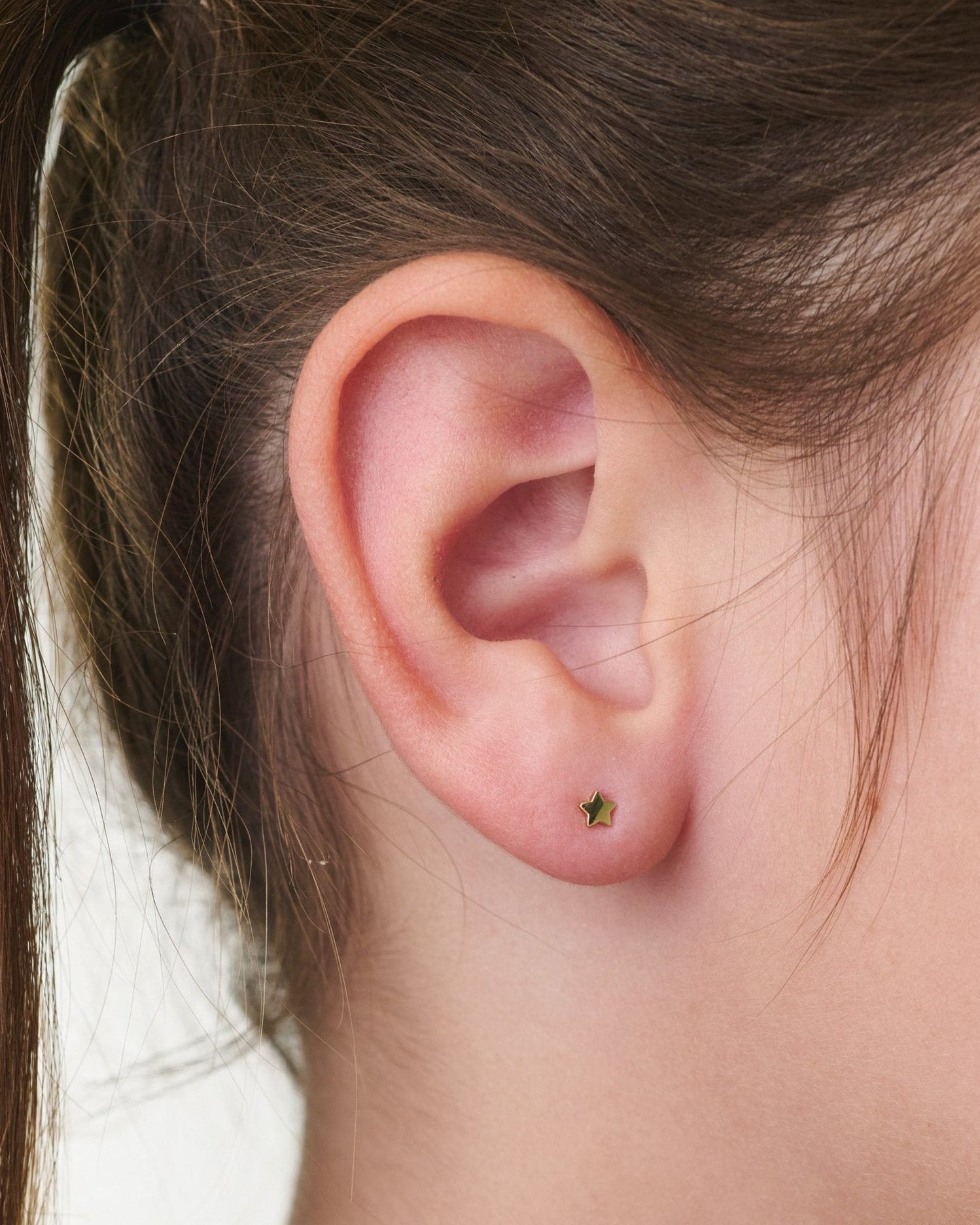 Gold star earring