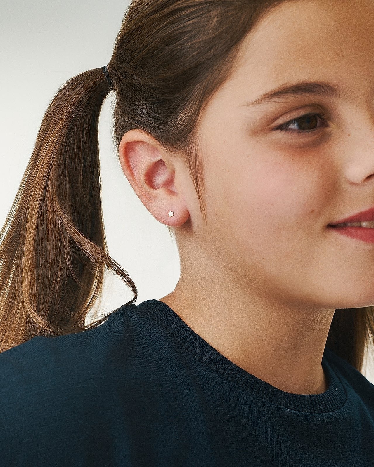Gold star earring