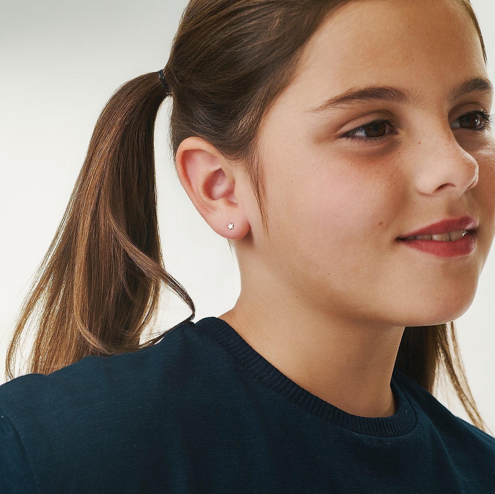 Gold star earring