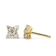 gold stud earrings with five white diamonds