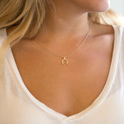 horseshoe pendant with diamonds