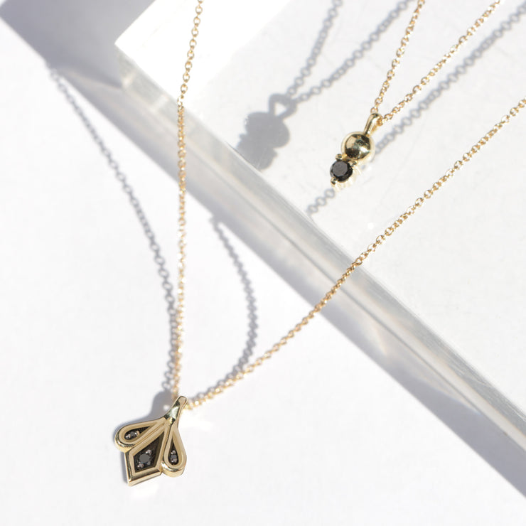 gold and black diamond necklace marie
