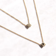 gold necklace with flower of diamonds
