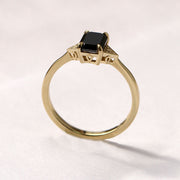 gold ring with emerald cut diamond