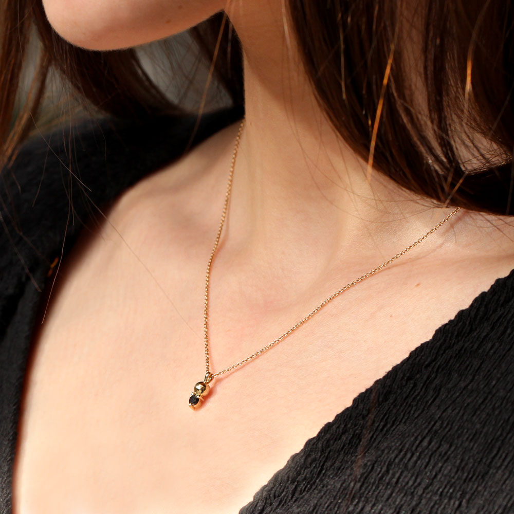 Gold Black Diamond Necklace on a model