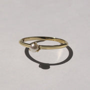 delicate gold ring with pearl