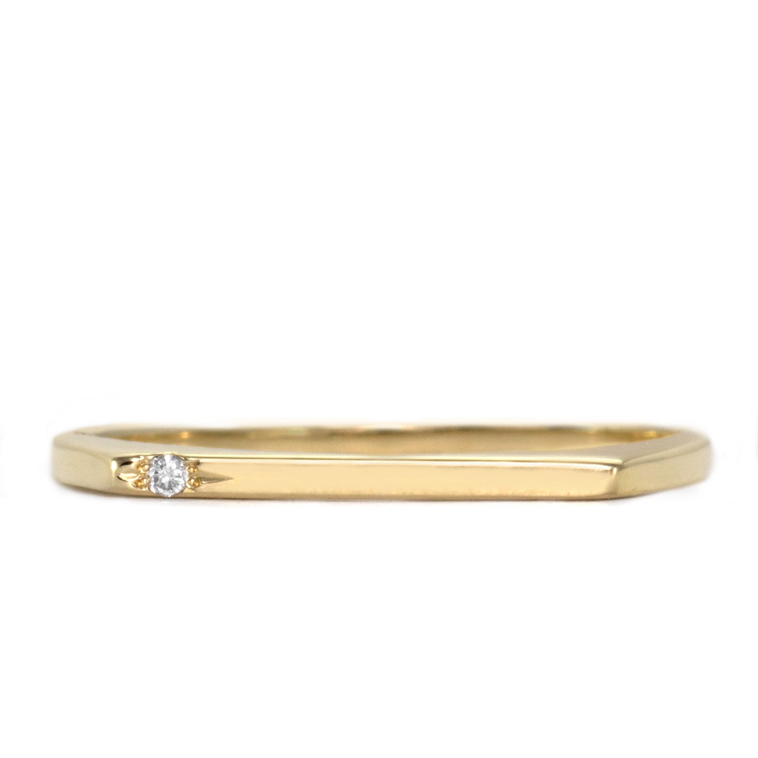 thin gold ring with one diamond