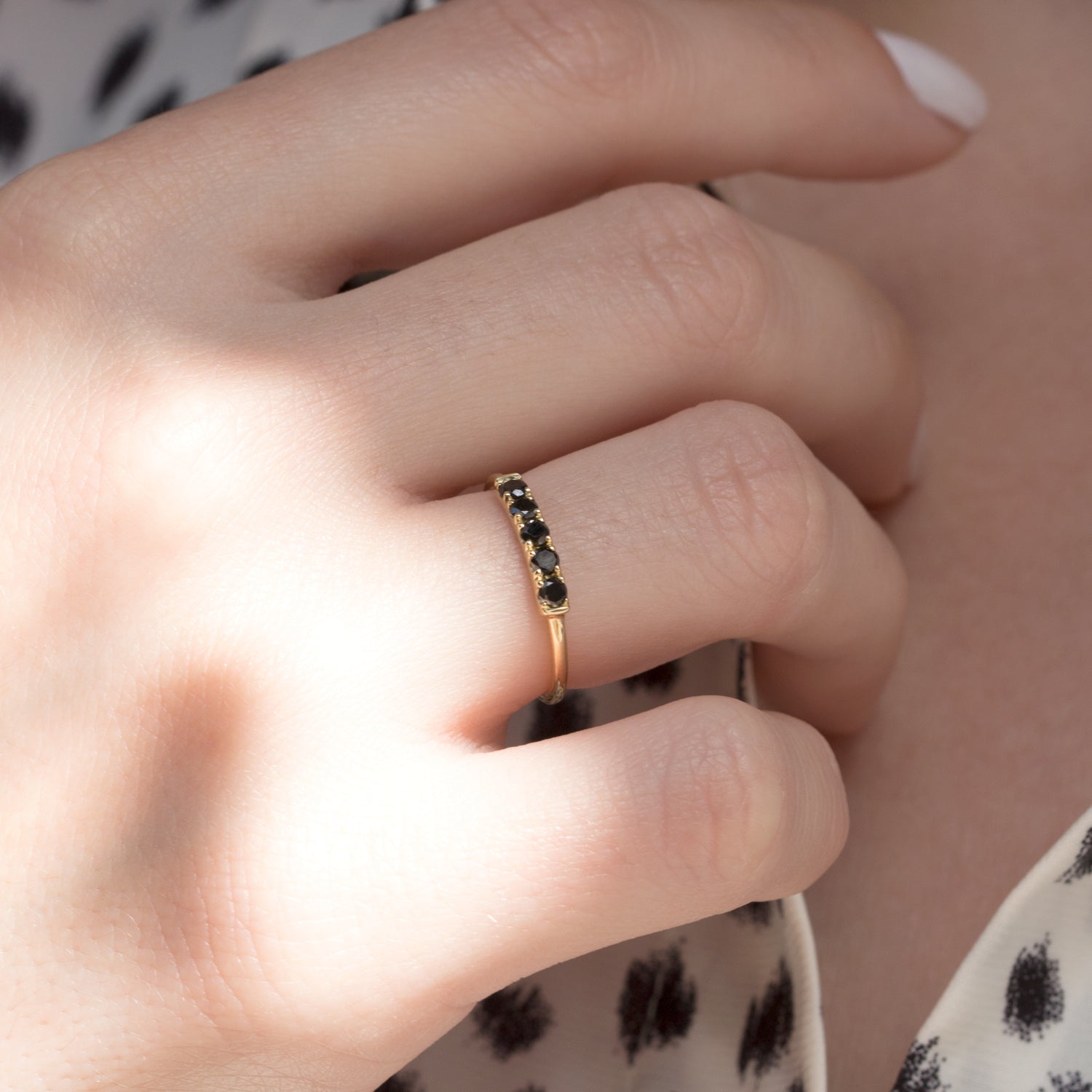 gold ring with black diamonds
