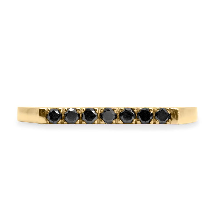 gold ring with seven black diamonds